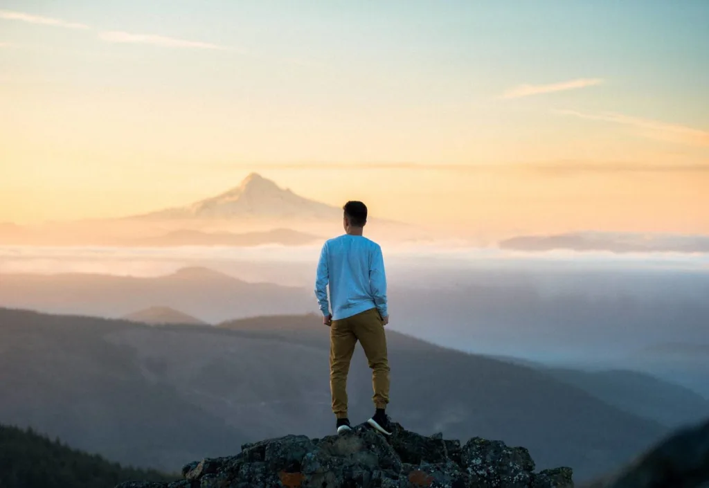 Man on mountain mindfulness concept